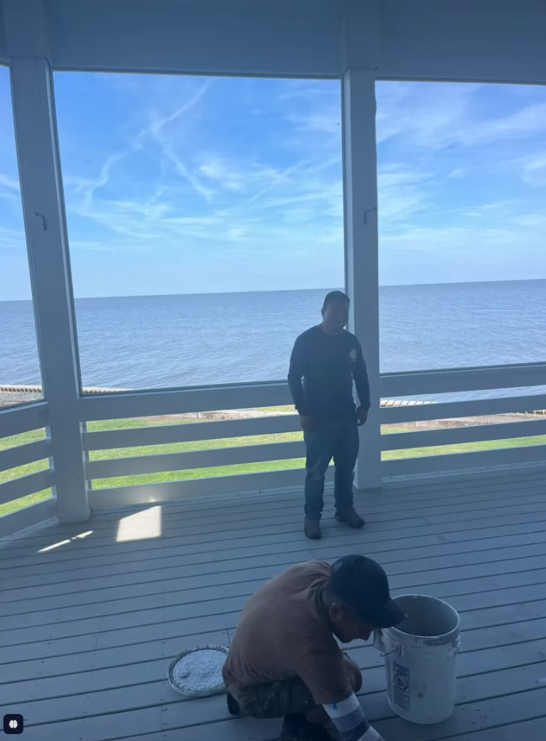 Screen porch over the sound being repainted by Cas and Cal Construction