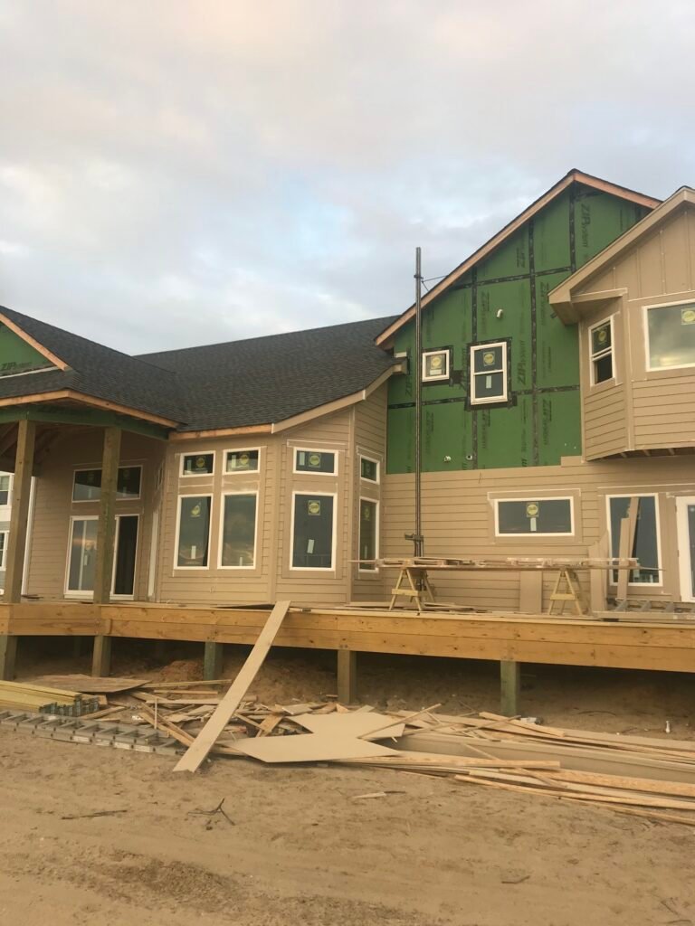 Siding and rear decks going on by Cas and Cal Construction