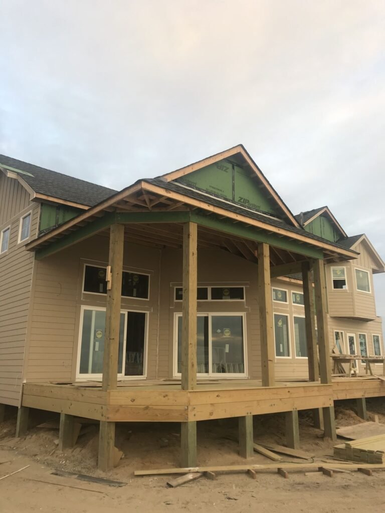 Covered porch and lap siding on a custom home built by Cas and Cal Construction