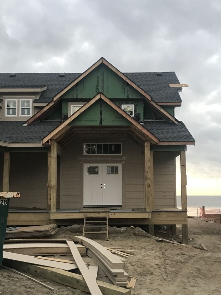 Front entry gables and double doors on a custom home by Cas and Cal Construction