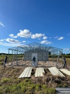 Crew framing the metal building