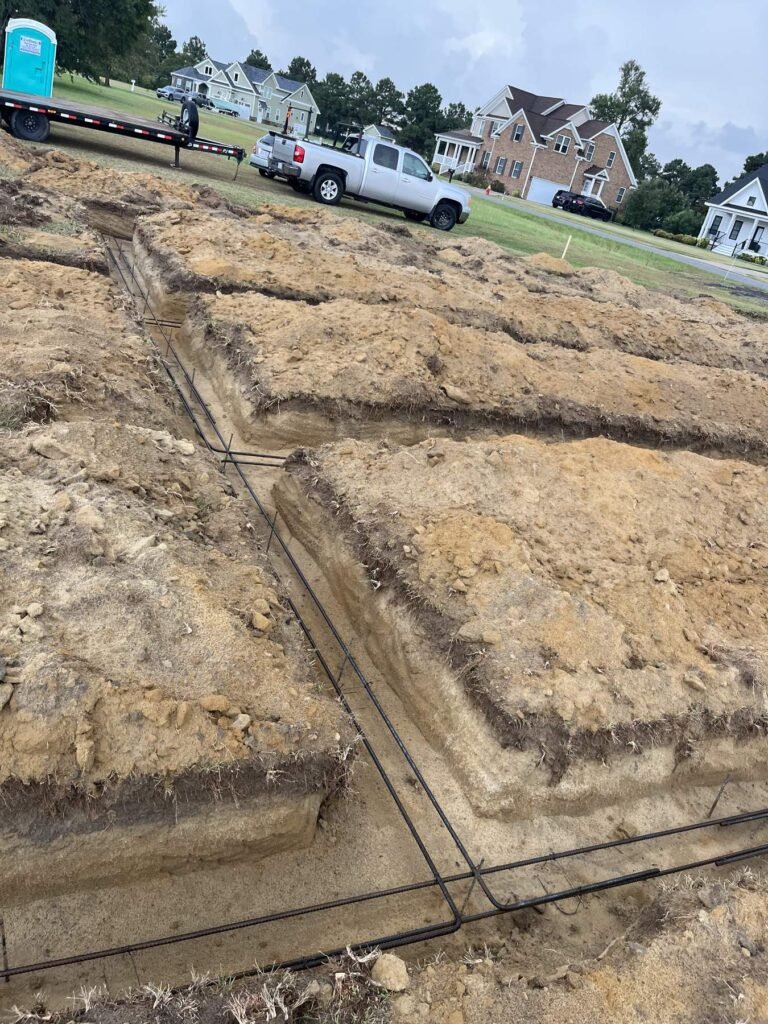 Rebar laid in footing trenches ready for inspection, Cas and Cal Construction