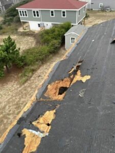 Rot and holes found under the shingles